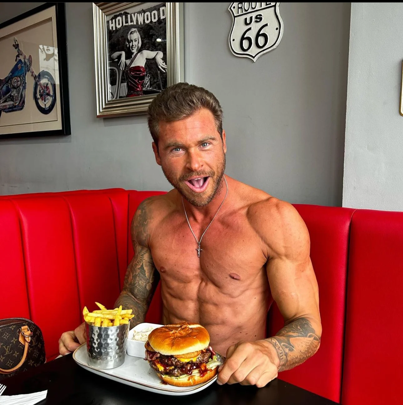 Luke eating a burger after a bodybuilding show