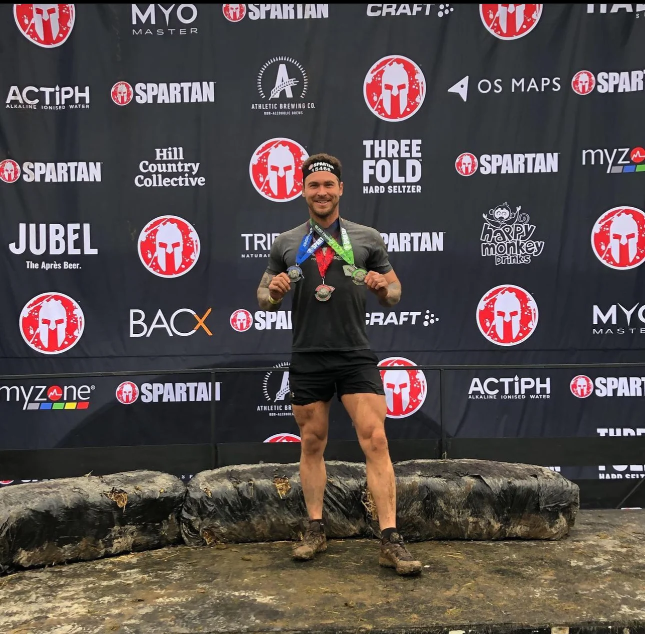 Luke at the finish line of a Spartan Trifecta race